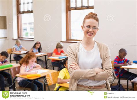 Pretty Teacher Smiling At Camera At Top Of Classroom Stock Image Image Of Group Crossed 50495859