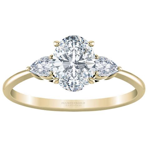 A three stone ring involves a large center stone complimented by 2 side stones, one on each side, creating a unique and elegant trio. Oval Diamond Three Stone Engagement Ring at Diamond and Go