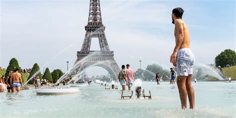 Paris Prepares For Heat Wave By Opening Swimming Pools And Mist