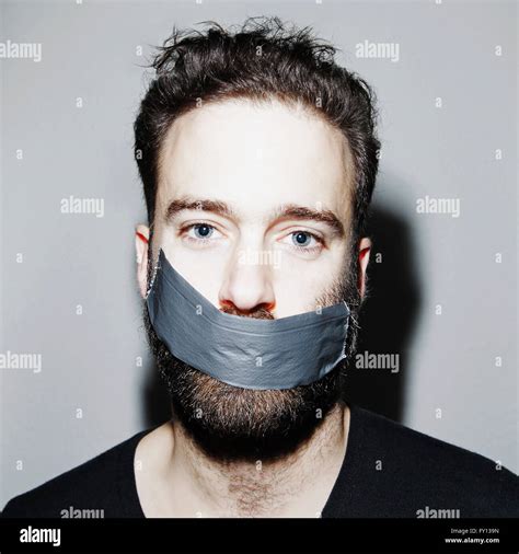 Portrait Of Man With Adhesive Tape Covering His Mouth Stock Photo Alamy