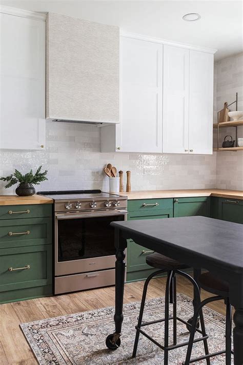 Light grey matte lacquer kitchen cabinets were combined with storage units that open to reveal black shelving for a different look when the pocket doors are open. 25 Green And White Kitchen Décor Ideas - DigsDigs