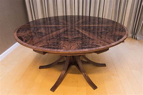 The top is veneered in walnut curl in a starburst formation with six lines of symmetry. Dining Tables — Johnson Furniture