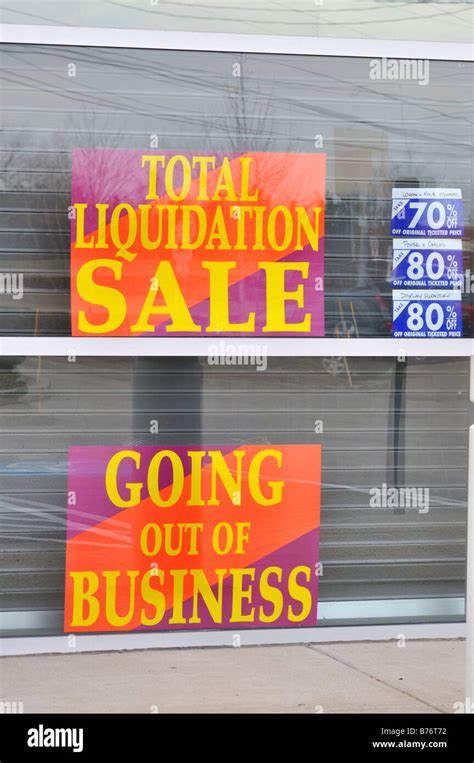 Total Liquidation Sale Signs In Storefront Windows Of A Closed Retail
