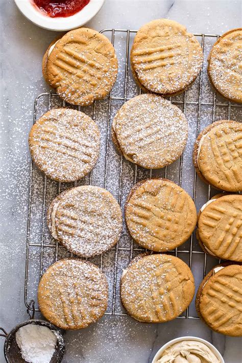 Stir into the peanut butter mixture. Peanut Butter Jelly Sandwich Cookies - Foodness Gracious