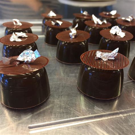 Chocolate Desserts Are Lined Up On A Silver Tray