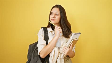 Stunning Young Hispanic Student Woman Confidently Holding A Book Lost