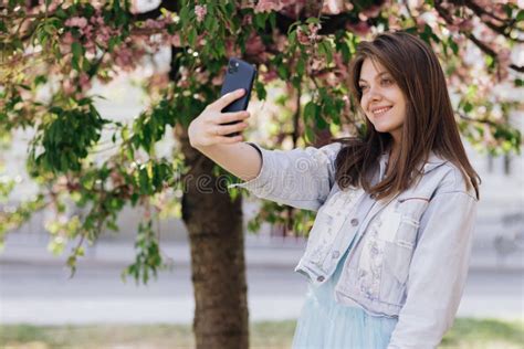 Young Smiling Woman Taking Selfie Self Portrait Photos On Smartphone