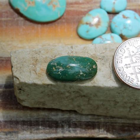 A Natural Dark Green Turquoise Cabochon Oval Stone Mountain Turquoise