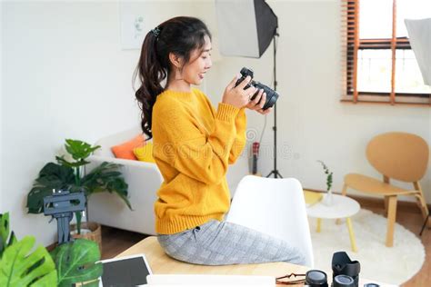 Lifestyle Asia Young Women Photographer And Freelance Holding A Dslr