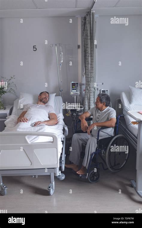 Male Patients Interacting With Each Other In The Ward Stock Photo Alamy