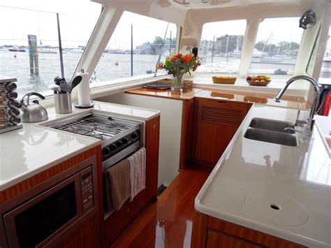As a result, automotive styling often sneaks its way into yacht design, whether it's in the particular swoop of an exterior profile or elements of interior detailing, from drawer pulls to furniture edging. Gunboat galley | Boat interior, Boat restoration, Yacht interior