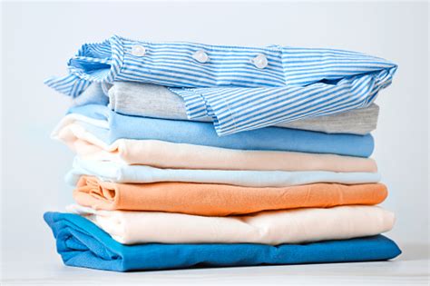 Stack Of Colorful Cotton Clothes Heap Of Folded Laundry Stock Photo