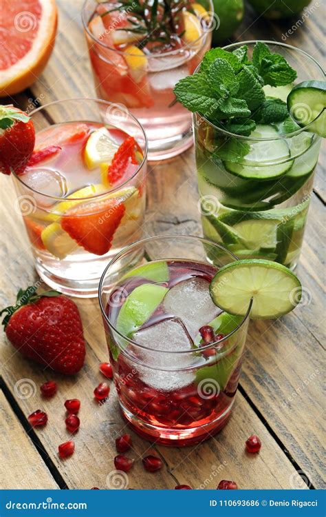 Fresh Lemonades With Strawberrieslemons Garnet Cucumbers And Mint