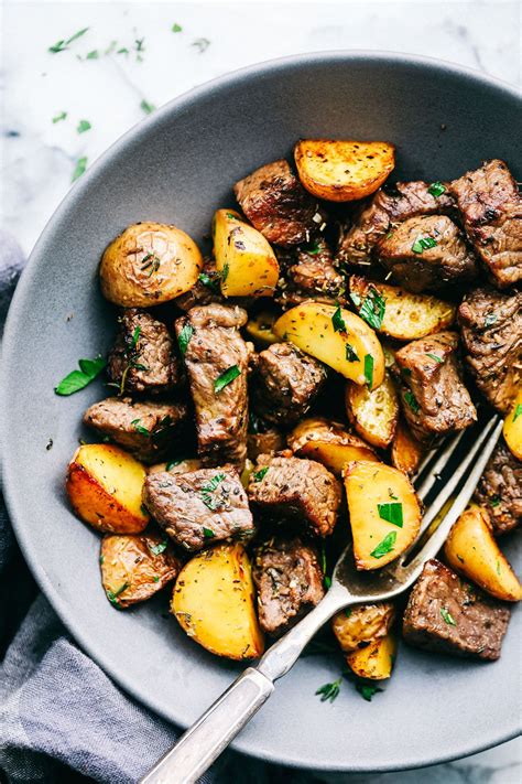 I cooked our steaks to medium, let them rest. Garlic Butter Herb Steak Bites with Potatoes are such a ...
