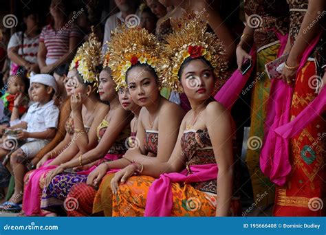 Local Girls With Ornate Gold Head Dresses In The Village Of Tenganan Bali During The Annual