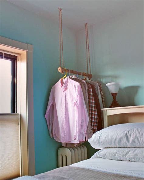 The double rail allows for ample space for your hanging clothes, while the two shelves give you room for shoes, hats, towels, or other folded clothes. Chic DIY Clothes Rack Ideas