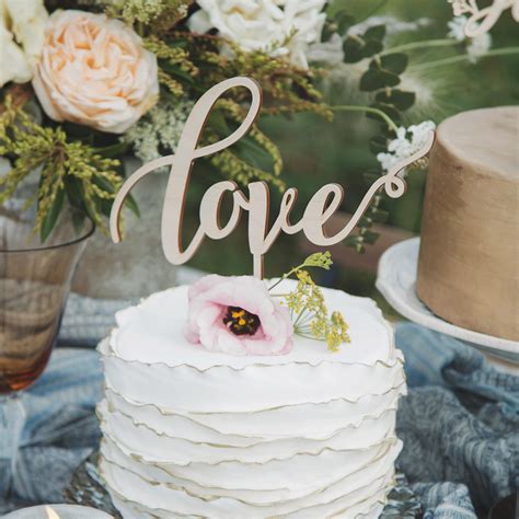 Inspired by love we gathered together some simply gorgeous and modern wedding cake designs featuring all the symbols that surround us and represent love in so many ways from the cupids bow and arrow, the iconic heart shape and the letters of love. Love Cake Topper - Thistle and Lace Designs Inc