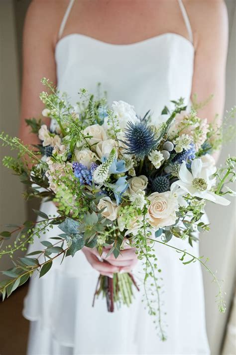 A Textural Wedding Bouquet With Blue Thistles White Blooms Various