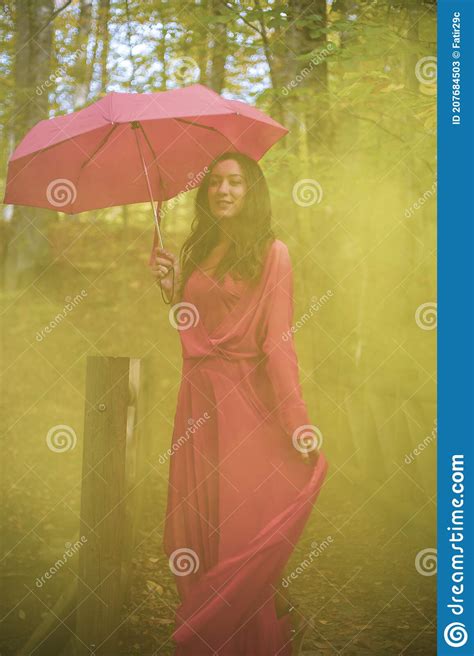 Red Umbrella And Red Dress Woman Outdoors In Autumn Forest Stock Image