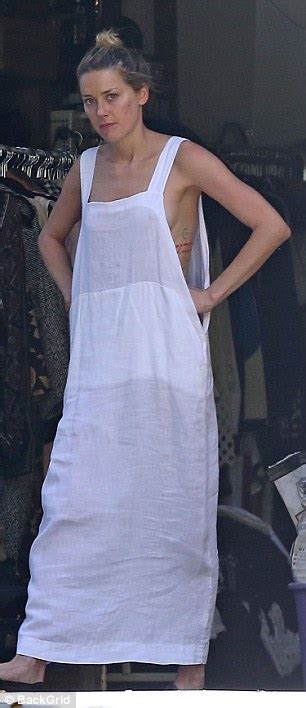 Amber Heard Flashes A Little Too Much In Loose Fitting Dress As She