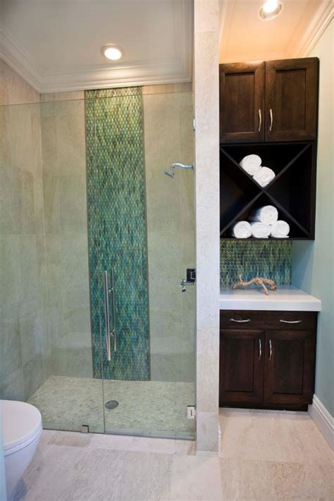 They range from tiny powder rooms to large master bathrooms. Transitional Poolhouse Shower With Pebble Floor | HGTV