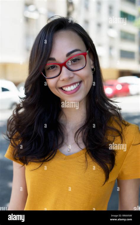 Portrait Of Beautiful Nerdy Girl With Glasses Outdoor In The City Stock