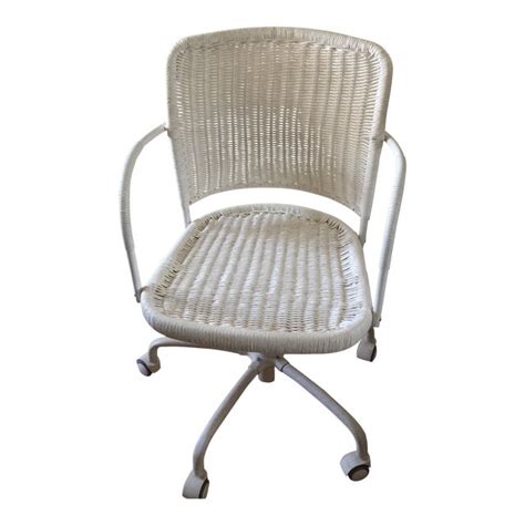 If your chair is rolling on you while you're trying to sit, then it might be because your floor is a bit slippery. White Wicker Rolling Desk Chair | Chairish