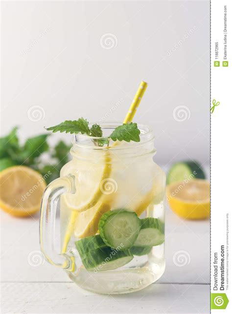 Infused Water With Lemon Cucumber And Mint On Wooden Background Detox