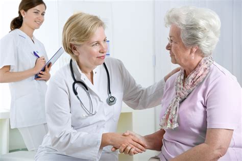Doctor Explaining Diagnosis To His Female Patient Health Plans In Oregon