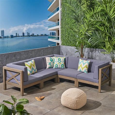 The armrest curve on both this wooden sofa set is the base of a blissful sleeper, the perfect comfort zone to sit or lay on. Elisha Outdoor 5 Piece Acacia Wood Sectional Sofa Set with ...