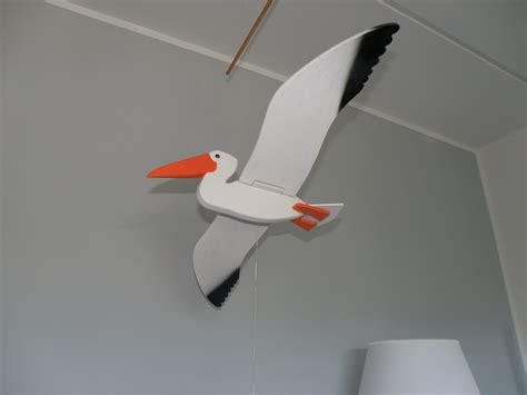 wooden flying bird mobile - pelican | Bird mobile, Wooden diy ...