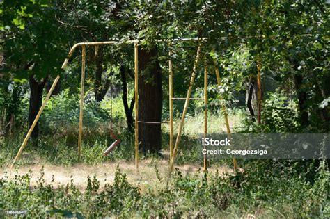 Old Unused Playground Overgrown In A Park Stock Photo Download Image