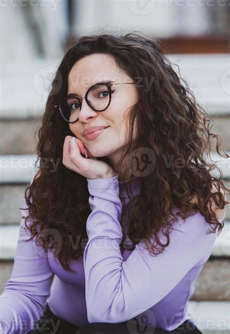 Beautiful Young Woman With Brunette Curly Hair Portrait In Eye Glasses Enjoying The Sun In The