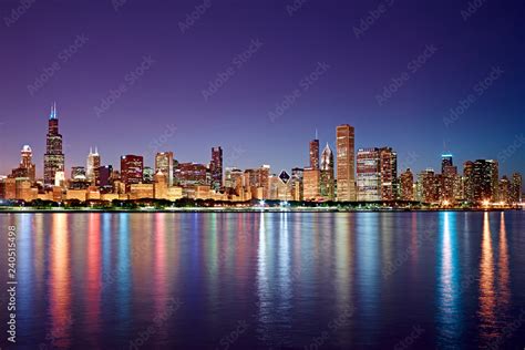 Chicago Skyline At Night With Skyscraper Reflections In Lake Michigan