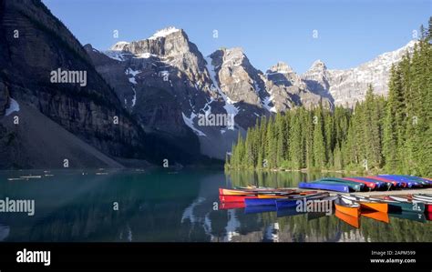 A Morning Shot Of Canoes Tied Up To A Dock At Moraine Lake In Banff