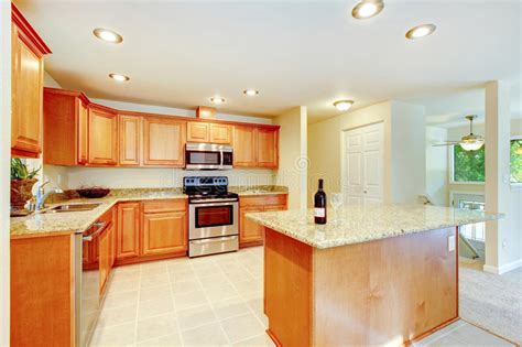 Our selection of backsplashes and wall tiles, countertops, and laminate offer durability and beauty. Bright Kitchen Room With Light Brown Cabinets And Steel ...