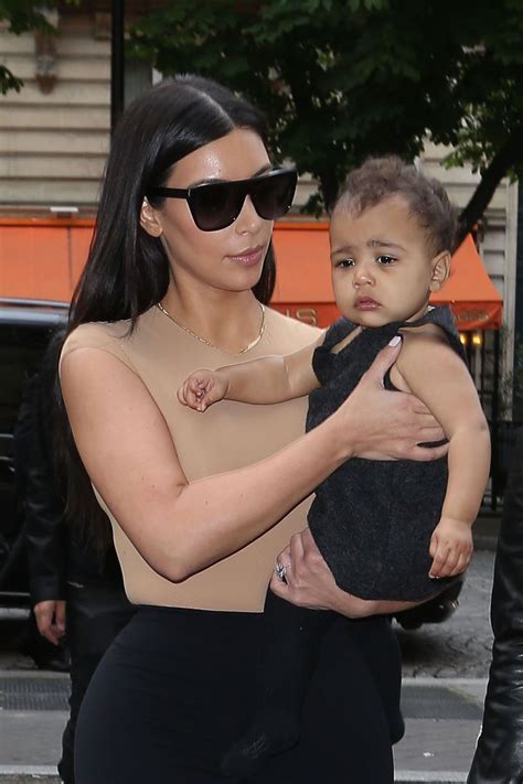 10 Cutest Pics Of Kim Kardashian Carrying North West [photos] 92 Q