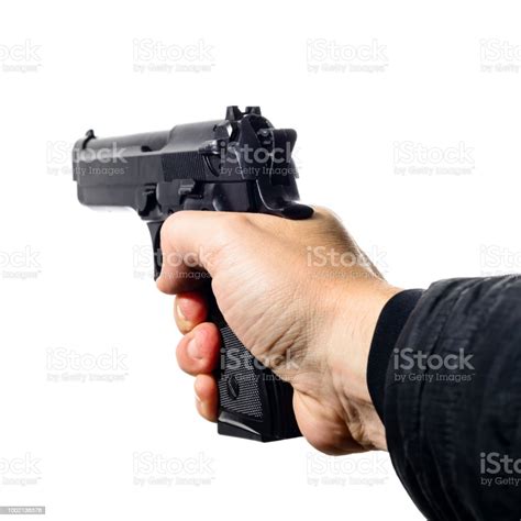 Mans Hand Holding A Black Pistol Gun Isolated On White Close Stock