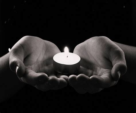 Hands Holding Lit Candle For Peace And Hope By Pink Sherbet Photography