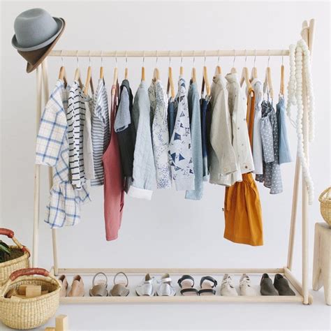 Looking for a wooden clothes rack that is spacious and stylish? Now This is How to Organize a Nursery Closet - Project Nursery
