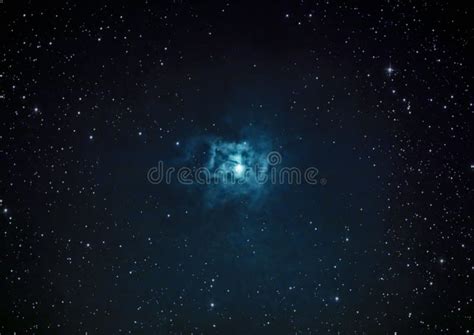 Gorgeous View Of The Iris Nebula Glowing Blue With Bright Stars Around
