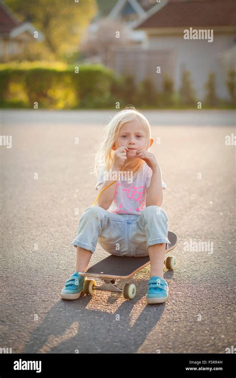 Sweden Vastergotland Lerum Portrait Of Girl 6 7 On Skateboard