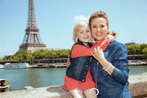 Happy Mother And Child Tourists In Paris France Embracing Stock Photo