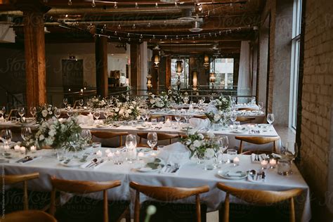 Long Tables Set Up For Wedding Reception Inside Old Building By