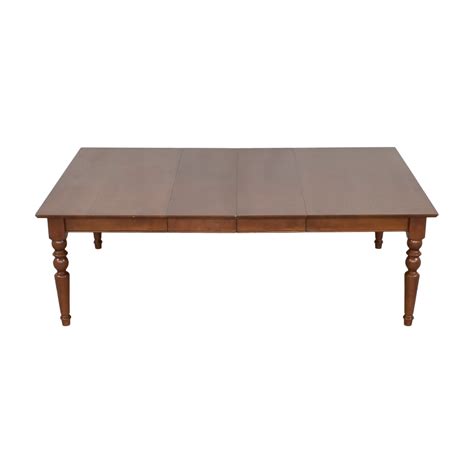 A Wooden Table With Two Legs And A Square Top On An Isolated White Background