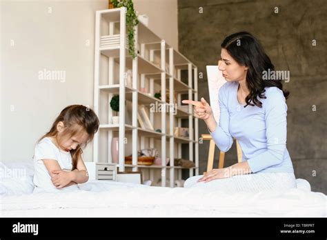 Mother Scolding Her Naughty Little Daughter At Home Stock Photo Alamy