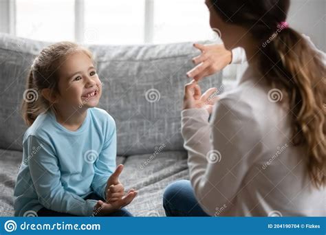 Smiling Cute Small Disabled Deaf Child Girl Learning Sign Language
