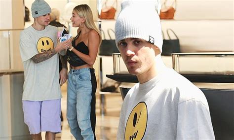 justin bieber rocks his drew label as he shops in beverly hills with his wife hailey daily