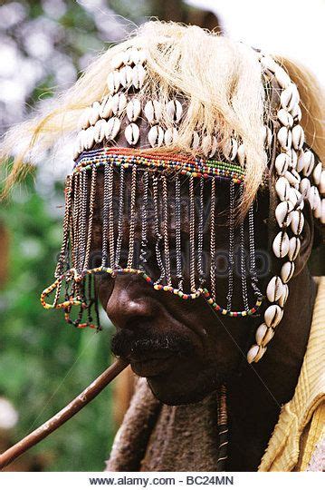 Nandi Elder Wearing Traditional Headdress Of Cowrie Shells And A Face