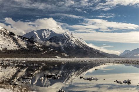 Icebergs Break Up The Reflection Of The Chugach Mountains In Turnagain